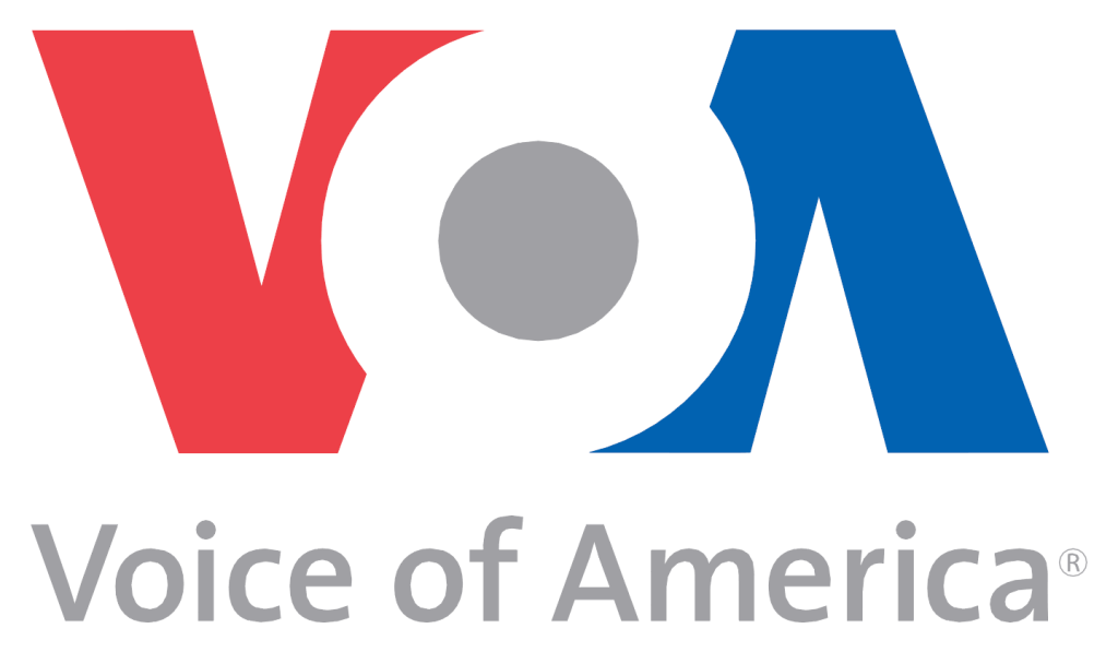 Logo of Voice of America featuring red 'V', a gray circle, and blue 'A', with the text 'Voice of America' below.